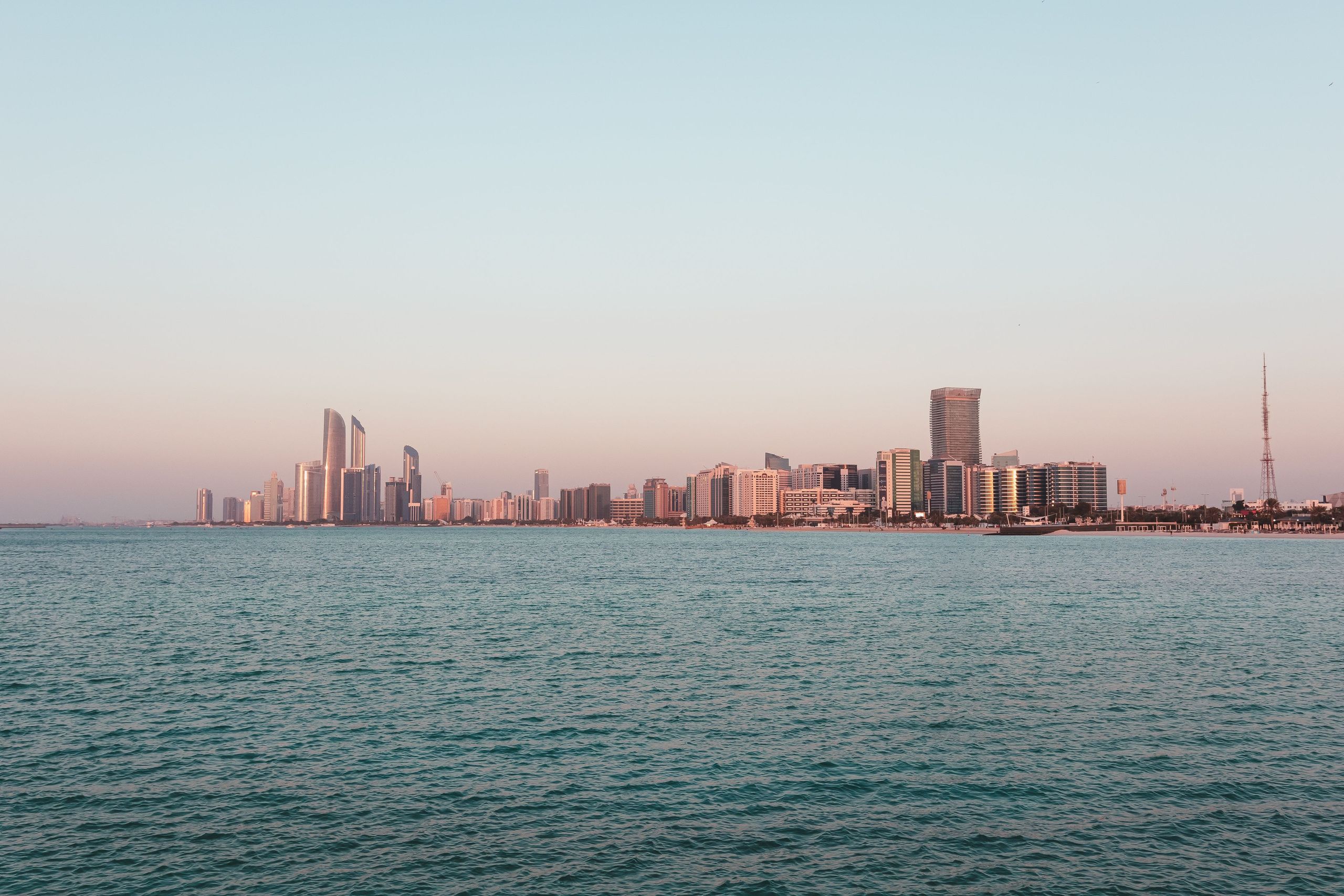 Etihad Towers and the Abu Dhabi skyline at dusk
